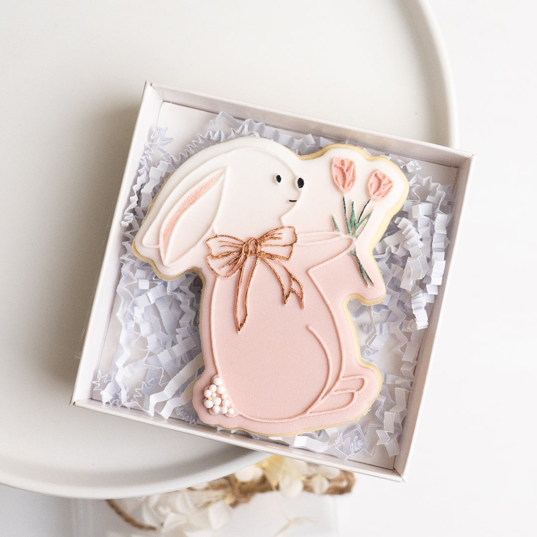 Bunny holding tulips stamp with matching cutter